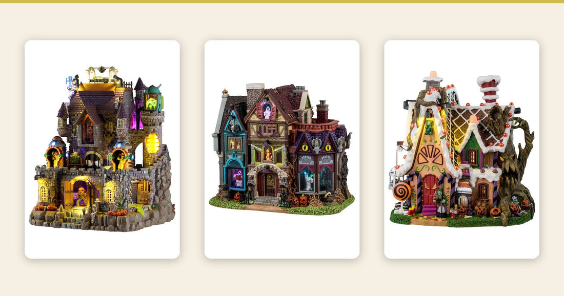 Three lit Lemax Spooky Town buildings: Dr. Dreadmoor's Castle, Madness Manor and The Candy Witch Cottage